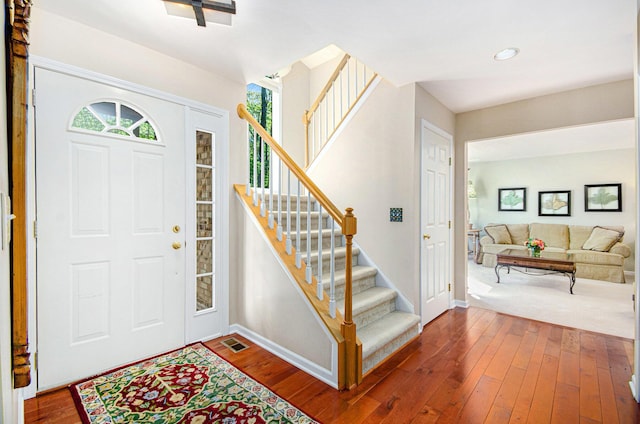 8461 Webster Hills Rd, Dexter, MI 48130 - entrance foyer featuring stairs, baseboards, dark wood-style floors, and recessed lighting