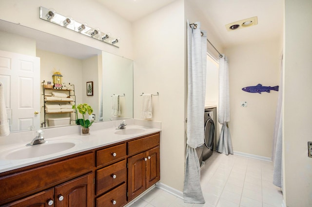 8461 Webster Hills Rd, Dexter, MI 48130 - full bath with tile patterned flooring, washer / clothes dryer, double vanity, and baseboards