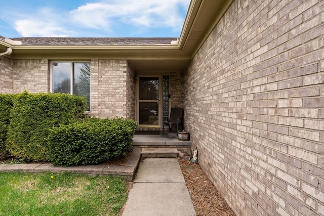 47697 Barclay Ct, Shelby Twp, MI 48317 - property entrance with brick siding and a shingled roof
