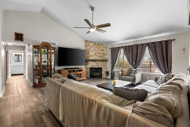 47697 Barclay Ct, Shelby Twp, MI 48317 - living room with a ceiling fan, wood finished floors, high vaulted ceiling, a fireplace, and baseboards