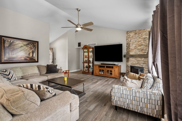 47697 Barclay Ct, Shelby Twp, MI 48317 - living area featuring vaulted ceiling, a ceiling fan, wood finished floors, baseboards, and a fireplace