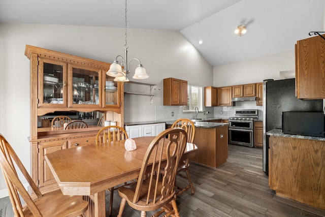 47697 Barclay Ct, Shelby Twp, MI 48317 - dining room featuring high vaulted ceiling, dark wood-type flooring, and a chandelier