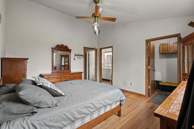47697 Barclay Ct, Shelby Twp, MI 48317 - bedroom featuring light wood finished floors, connected bathroom, baseboards, and a ceiling fan