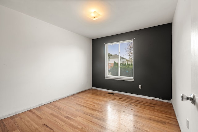 47697 Barclay Ct, Shelby Twp, MI 48317 - unfurnished room with light wood finished floors and baseboards