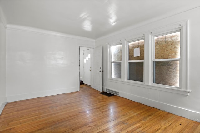 8916 Mendota St, Detroit, MI 48204 - unfurnished room with light wood-type flooring, baseboards, and crown molding