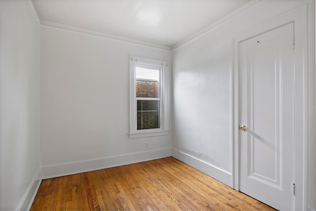 8916 Mendota St, Detroit, MI 48204 - spare room featuring baseboards, light wood-style flooring, and crown molding