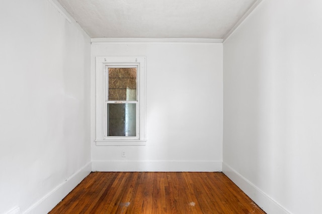 8916 Mendota St, Detroit, MI 48204 - spare room featuring dark wood finished floors, baseboards, and ornamental molding
