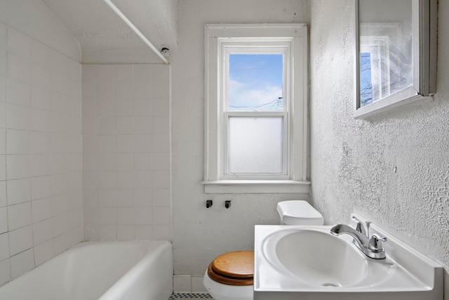 8916 Mendota St, Detroit, MI 48204 - full bathroom with toilet, a textured wall, plenty of natural light,  shower combination, and vanity