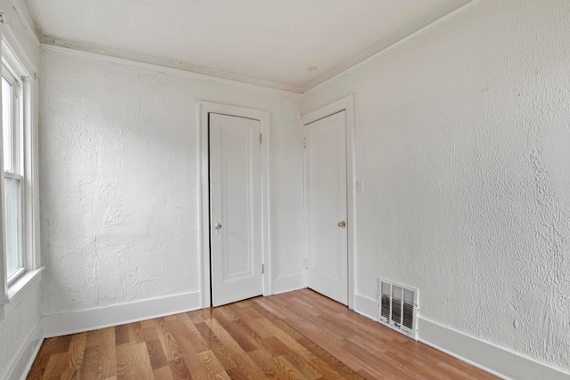 8916 Mendota St, Detroit, MI 48204 - unfurnished room featuring wood finished floors, baseboards, and ornamental molding