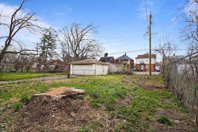 8916 Mendota St, Detroit, MI 48204 - view of yard featuring a garage and fence