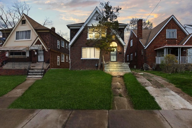 8916 Mendota St, Detroit, MI 48204 - tudor home with a lawn and brick siding