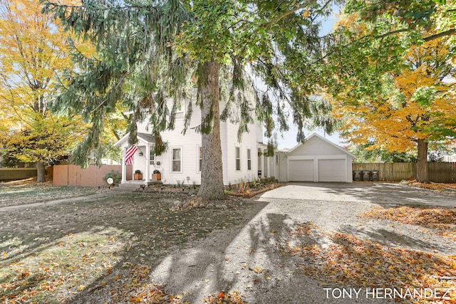 836 Phoenix St, South Haven, MI 49090 - view of front of home featuring fence, driveway, and an outdoor structure