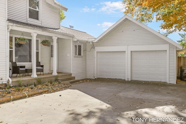 836 Phoenix St, South Haven, MI 49090 - view of front of home featuring a garage, a porch, and roof with shingles