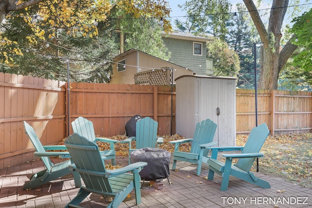836 Phoenix St, South Haven, MI 49090 - view of patio featuring a fire pit and a fenced backyard