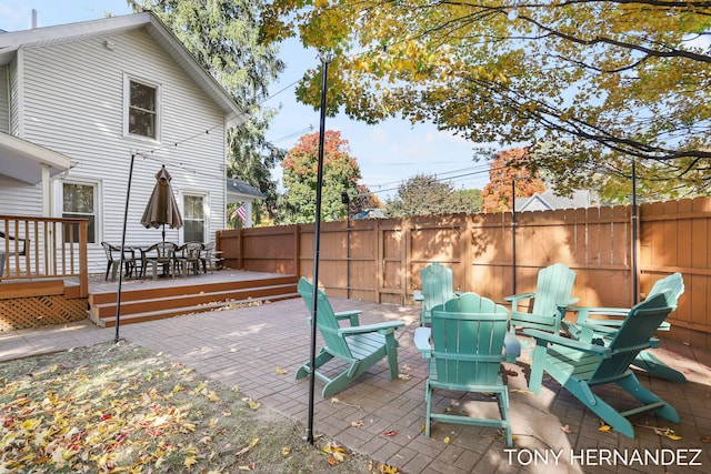 836 Phoenix St, South Haven, MI 49090 - view of patio featuring a wooden deck, an outdoor fire pit, and outdoor dining space