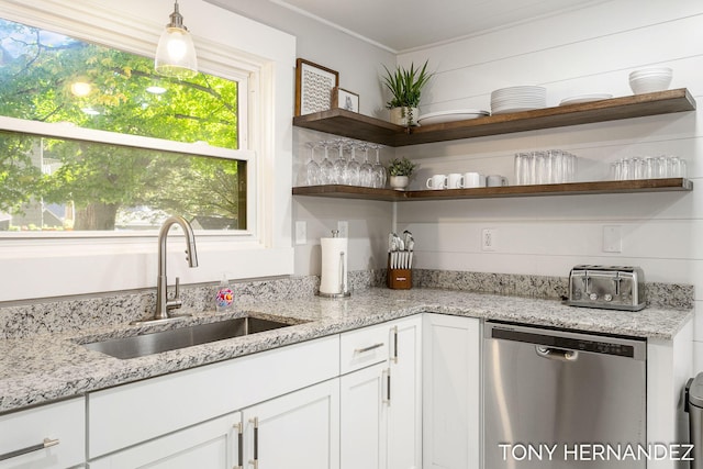 836 Phoenix St, South Haven, MI 49090 - kitchen with stainless steel dishwasher, a sink, open shelves, white cabinets, and ornamental molding