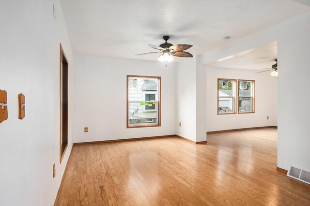 214 S Monroe St, Sturgis, MI 49091 - unfurnished room with ceiling fan, healthy amount of natural light, light wood-type flooring, and baseboards