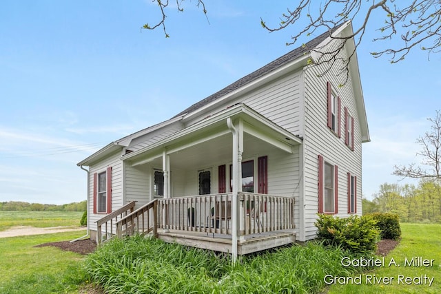 49 E 112th St, Grant, MI 49327 - view of front facade with a porch