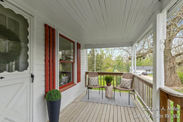 49 E 112th St, Grant, MI 49327 - wooden terrace with covered porch