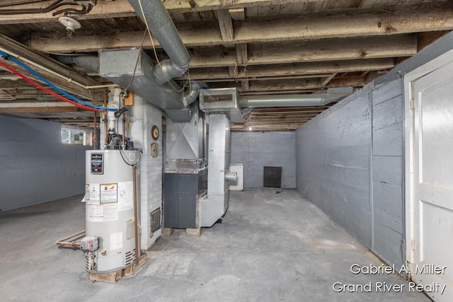 49 E 112th St, Grant, MI 49327 - below grade area with gas water heater, heating unit, and washer / dryer