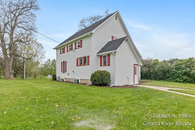 49 E 112th St, Grant, MI 49327 - view of home's exterior featuring a lawn and roof with shingles