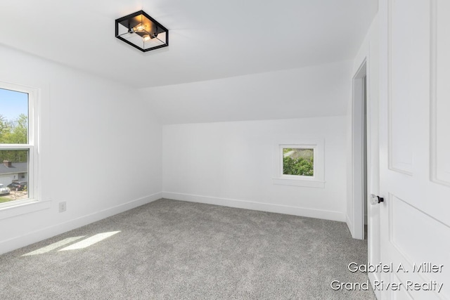 49 E 112th St, Grant, MI 49327 - bonus room featuring vaulted ceiling, carpet floors, and baseboards