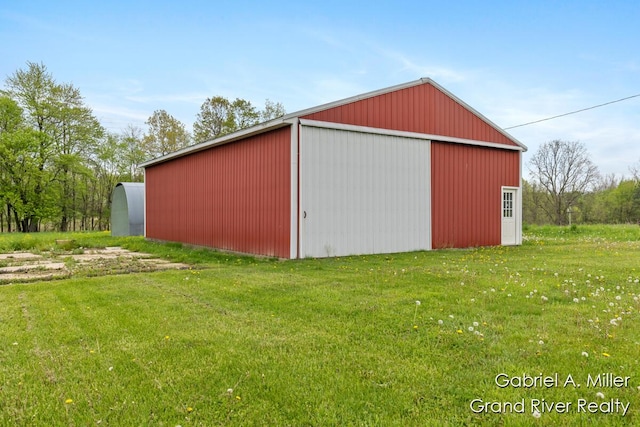 49 E 112th St, Grant, MI 49327 - view of pole building featuring a lawn