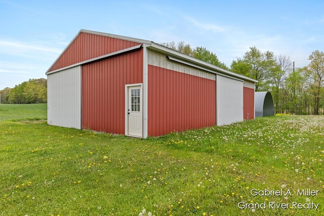 49 E 112th St, Grant, MI 49327 - view of pole building with a lawn