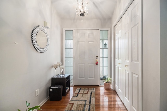 47291 Fairlawn Ct, Canton, MI 48188 - entrance foyer featuring wood finished floors, a chandelier, and baseboards