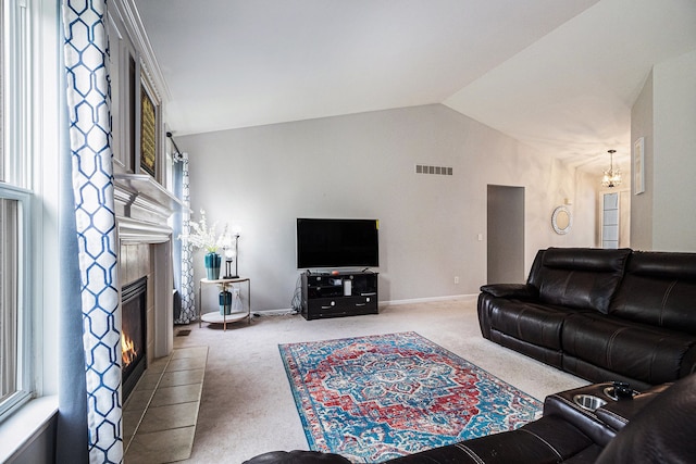 47291 Fairlawn Ct, Canton, MI 48188 - carpeted living room featuring a chandelier, lofted ceiling, a fireplace, and baseboards