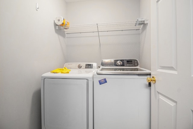 47291 Fairlawn Ct, Canton, MI 48188 - clothes washing area with washing machine and clothes dryer