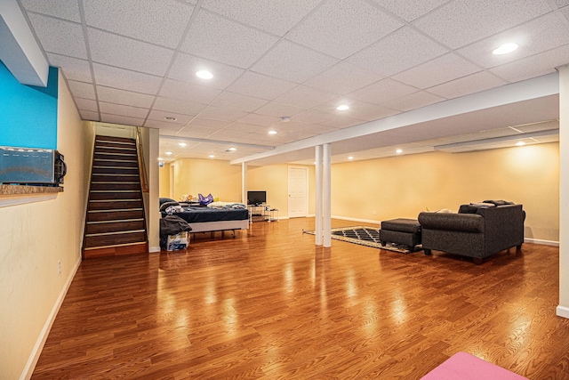 47291 Fairlawn Ct, Canton, MI 48188 - living room featuring wood finished floors, baseboards, stairs, and a paneled ceiling