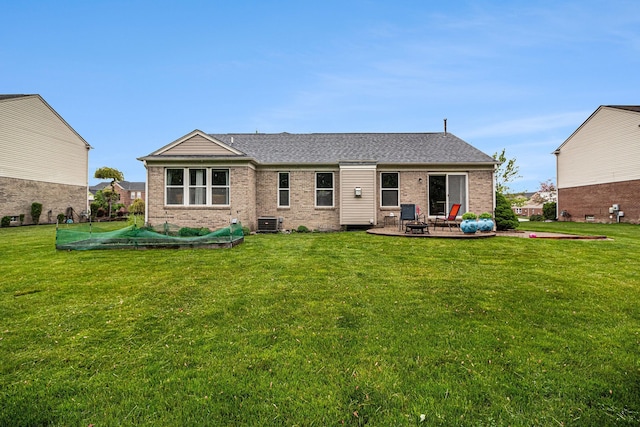 47291 Fairlawn Ct, Canton, MI 48188 - back of property with brick siding, a patio, a lawn, and central air condition unit