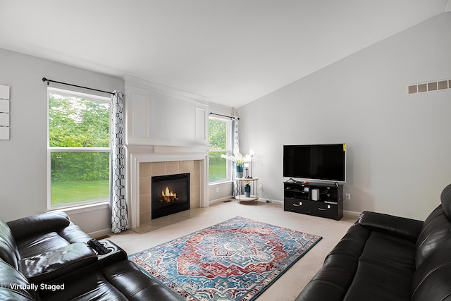 47291 Fairlawn Ct, Canton, MI 48188 - living room with a tiled fireplace, light colored carpet, plenty of natural light, vaulted ceiling, and baseboards