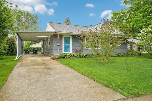 1815 Cooley Ave, Ann Arbor, MI 48103 - view of front of house with driveway, a front lawn, and an attached carport