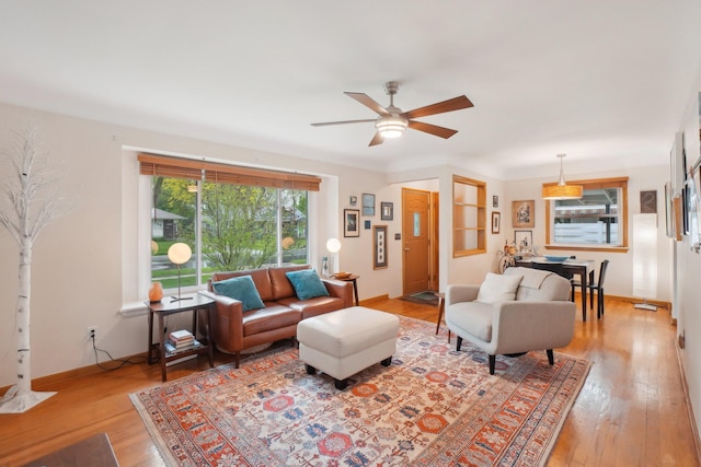 1815 Cooley Ave, Ann Arbor, MI 48103 - living room with ceiling fan, light wood finished floors, and baseboards