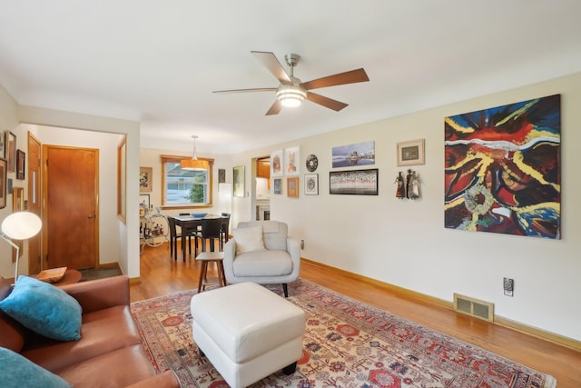 1815 Cooley Ave, Ann Arbor, MI 48103 - living room with ceiling fan, wood finished floors, and baseboards
