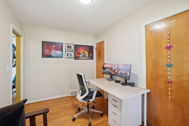 1815 Cooley Ave, Ann Arbor, MI 48103 - office with light wood-style flooring and baseboards