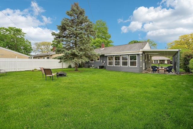 1815 Cooley Ave, Ann Arbor, MI 48103 - back of property with a chimney, a patio, and an outdoor living space with a fire pit