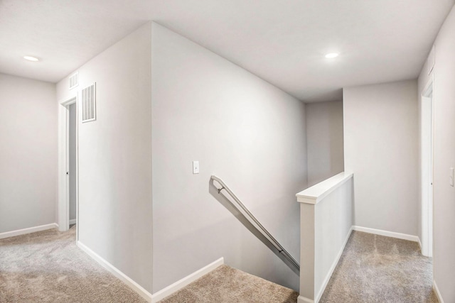 7987 Sierra Dr, Belding, MI 48809 - hall with an upstairs landing, carpet, baseboards, and recessed lighting