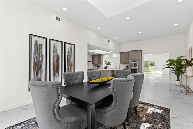 49712 Geddes Rd, Canton, MI 48188 - dining area featuring light marble finish flooring, recessed lighting, and baseboards