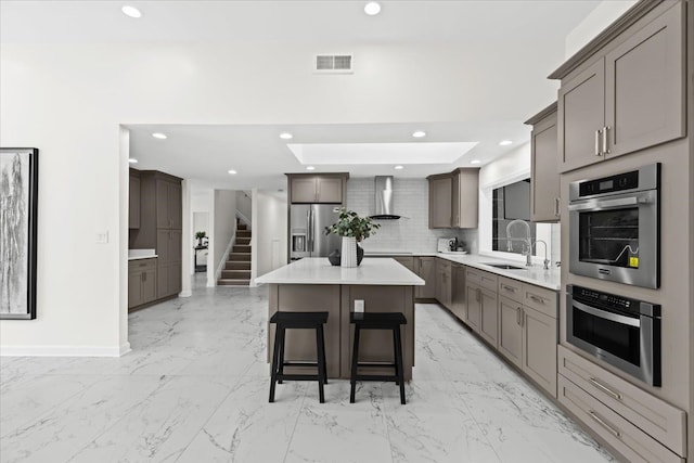49712 Geddes Rd, Canton, MI 48188 - kitchen featuring wall chimney range hood, stainless steel appliances, light marble finish flooring, a center island, and recessed lighting