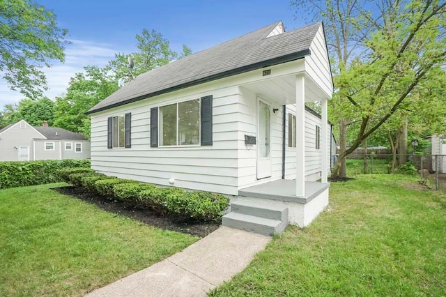 620 2nd Ave, Pontiac, MI 48340 - view of side of home with roof with shingles