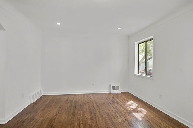 620 2nd Ave, Pontiac, MI 48340 - spare room featuring wood finished floors, baseboards, arched walkways, and recessed lighting