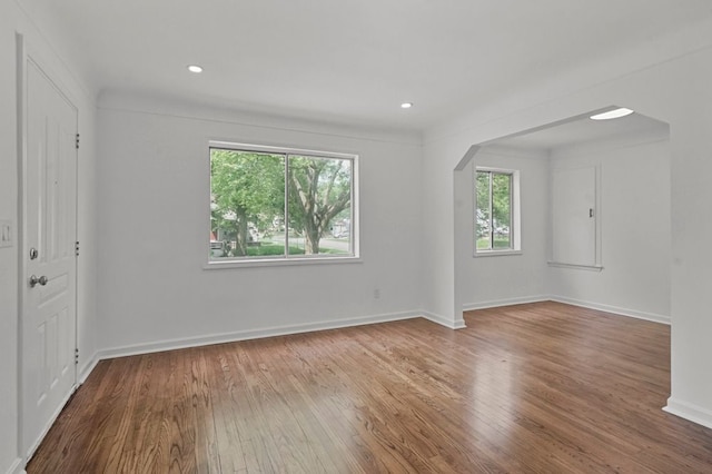 620 2nd Ave, Pontiac, MI 48340 - spare room featuring arched walkways, wood-type flooring, baseboards, and recessed lighting