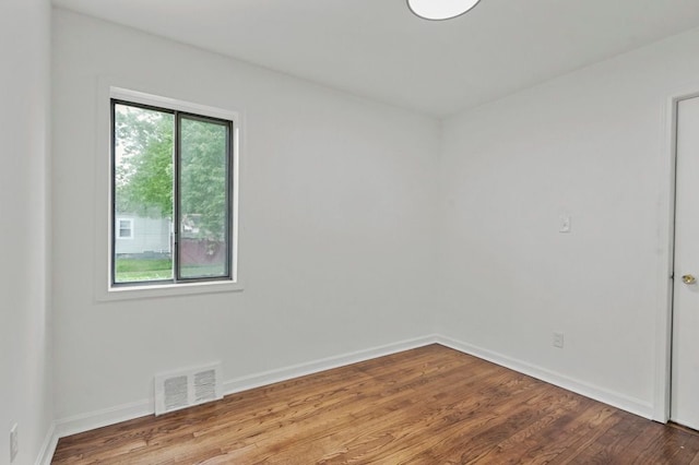 620 2nd Ave, Pontiac, MI 48340 - spare room featuring wood finished floors and baseboards