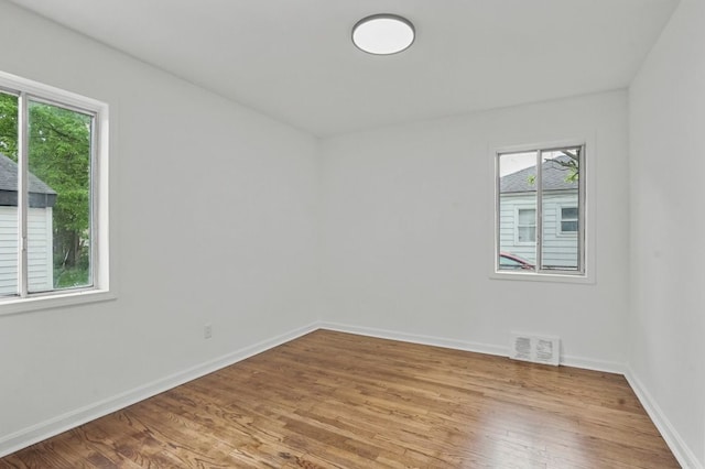 620 2nd Ave, Pontiac, MI 48340 - unfurnished room featuring plenty of natural light, light wood-type flooring, and baseboards