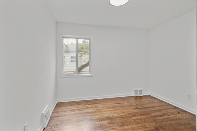 620 2nd Ave, Pontiac, MI 48340 - spare room with wood finished floors and baseboards