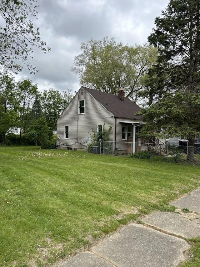rear view of house featuring a chimney