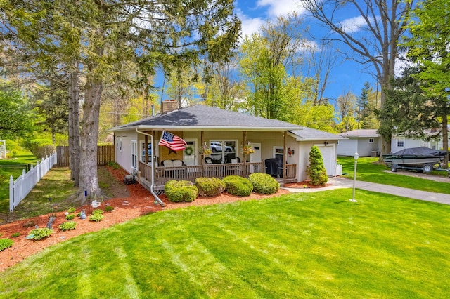 view of front of house featuring a chimney, driveway, covered porch, and a garage